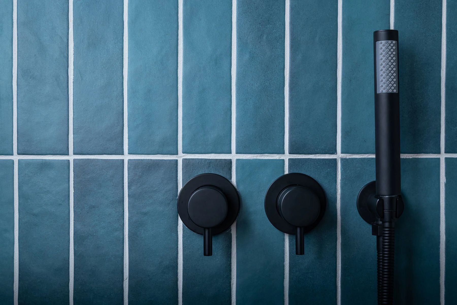 Vertical glazed tile with matte black valves